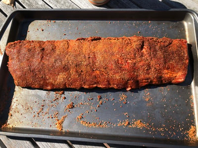 Baby back ribs rubbed with Placid Rib Rub