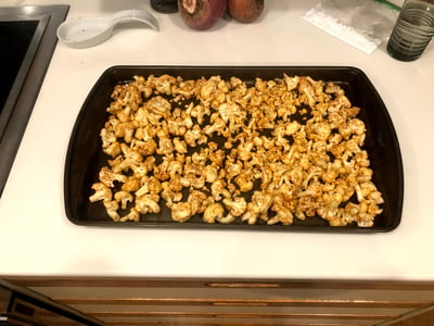 Spiced cauliflower on baking sheet